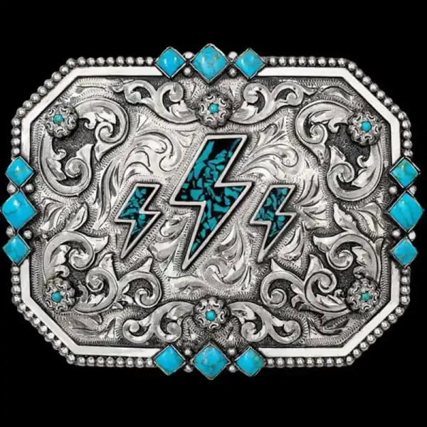 "This buckle's got the spark, ready to be worn and make a statement. Our Lynwood Belt Buckle is expertly hand-engraved on a German Silver base, showcasing our signature antique finish. Turquoise stones bring this piece to life, with bold accents thro